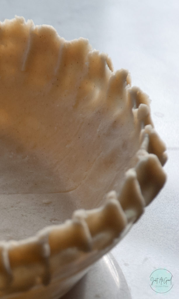 scalloped edge of gluten free pie crust