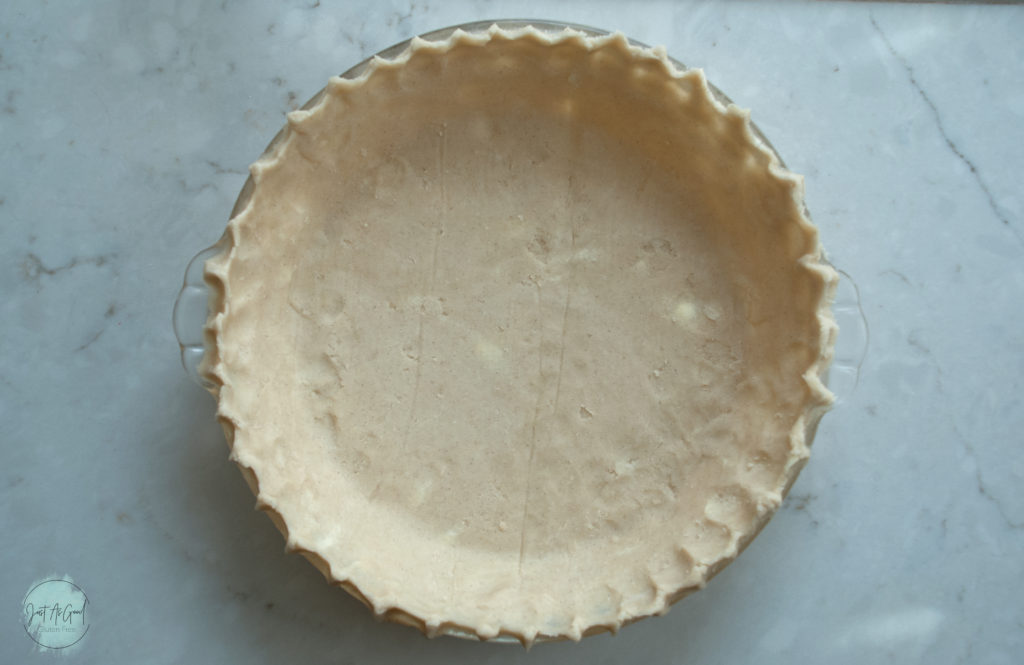 Whole gluten free pie dough in glass pan