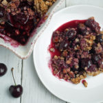 Gluten free cherry crisp on plate close up