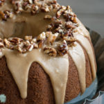 Gluten Free Apple Cake with brown sugar and cinnamon frosting and pecan praline topping