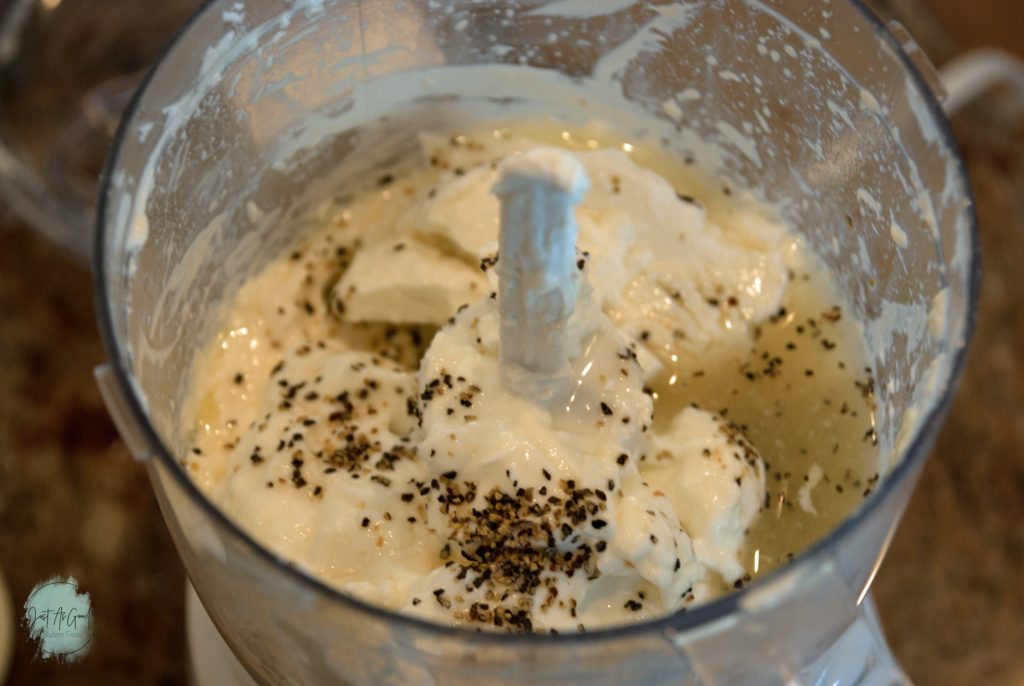 food processor top shot of whipped cream cheese, lemon juice, pepper and yogurt