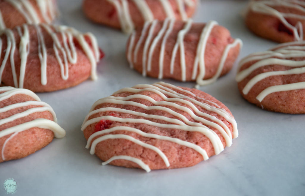 rows of gluten free cherry cookies drizzled in white chocolate