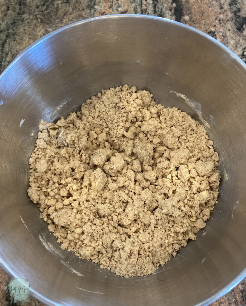 Gluten free pecan shortbread bowl of unmixed dough before pressing together