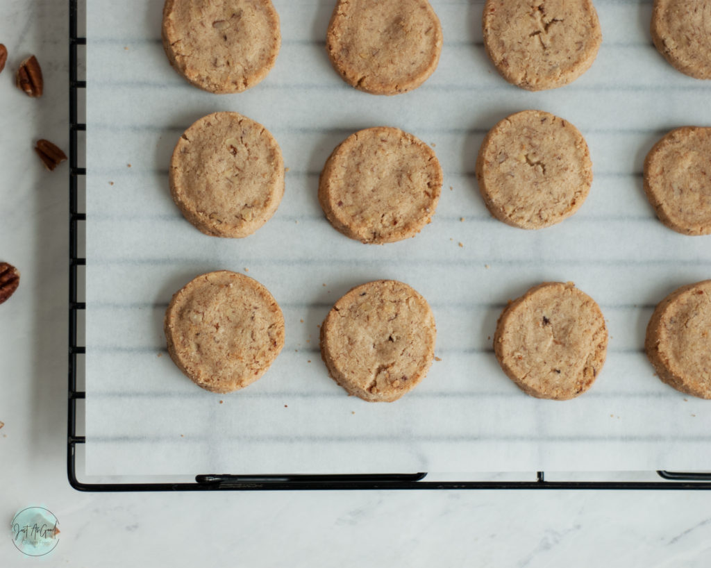 Gluten Free Pecan Shortbread Cookies on parchment paper and cookie rack from top view