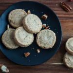 a plate of gluten free pecan shortbread cookies