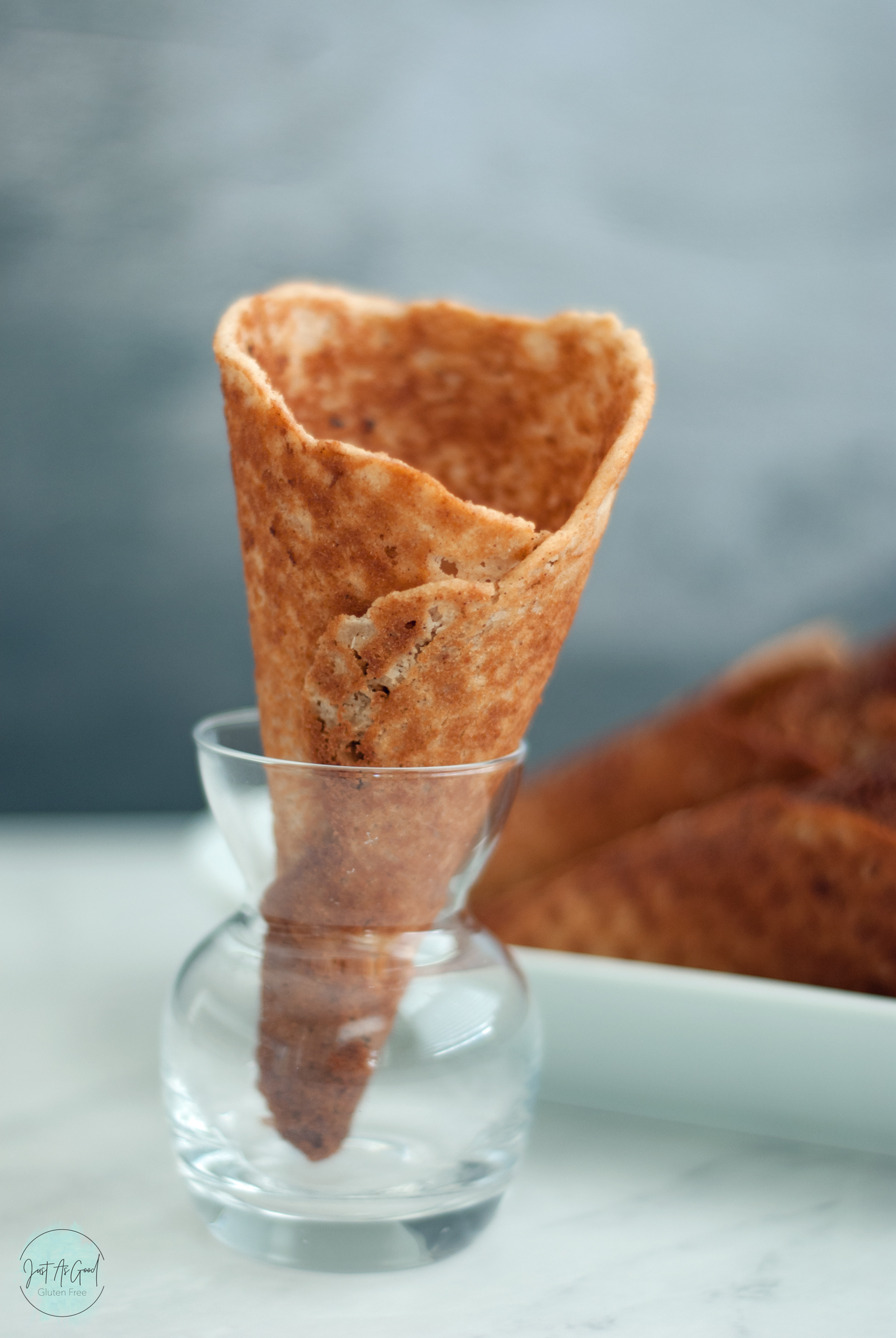 single waffle cone inside glass jar standing up