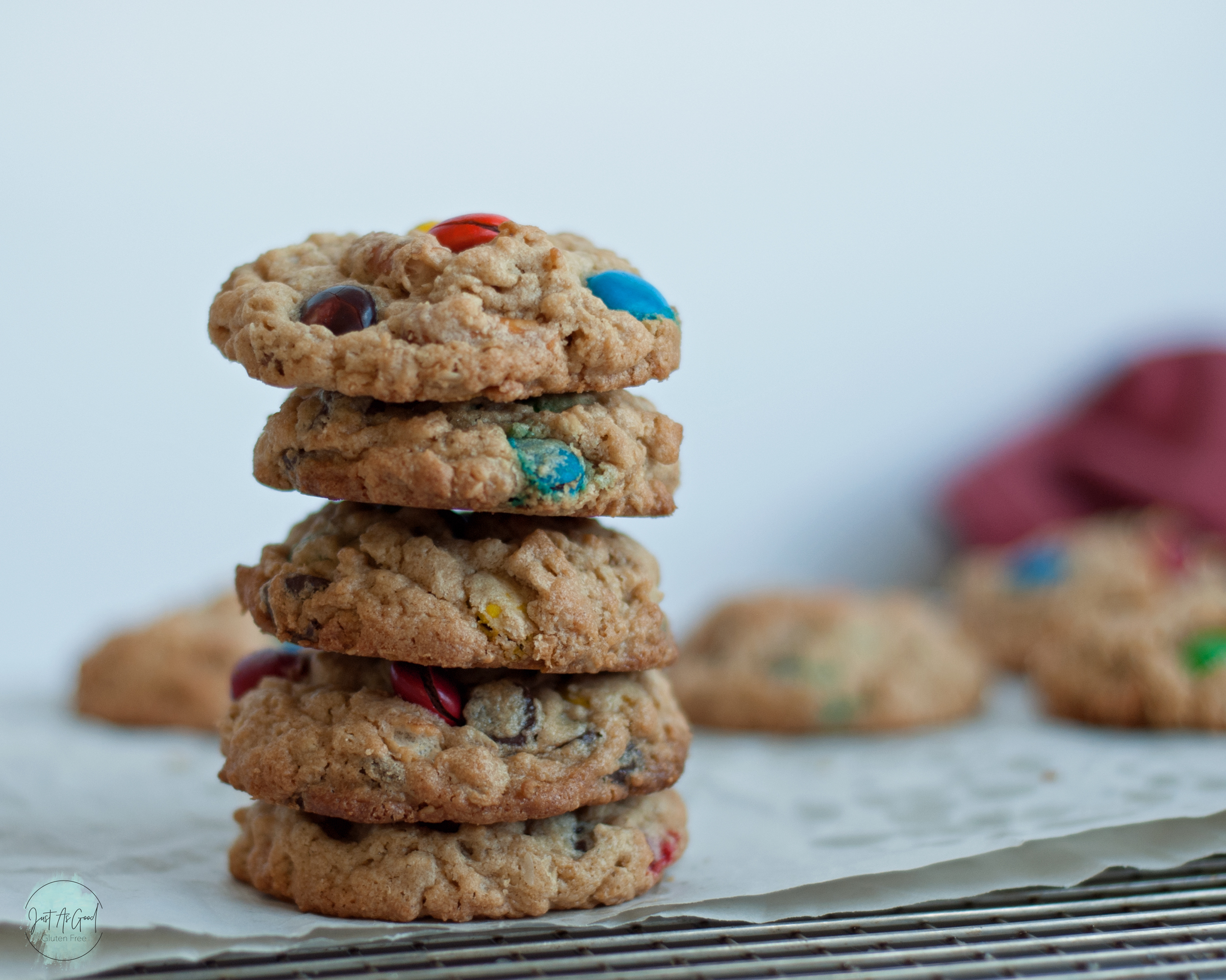 a stack of five gluten free monster cookies on baking rack