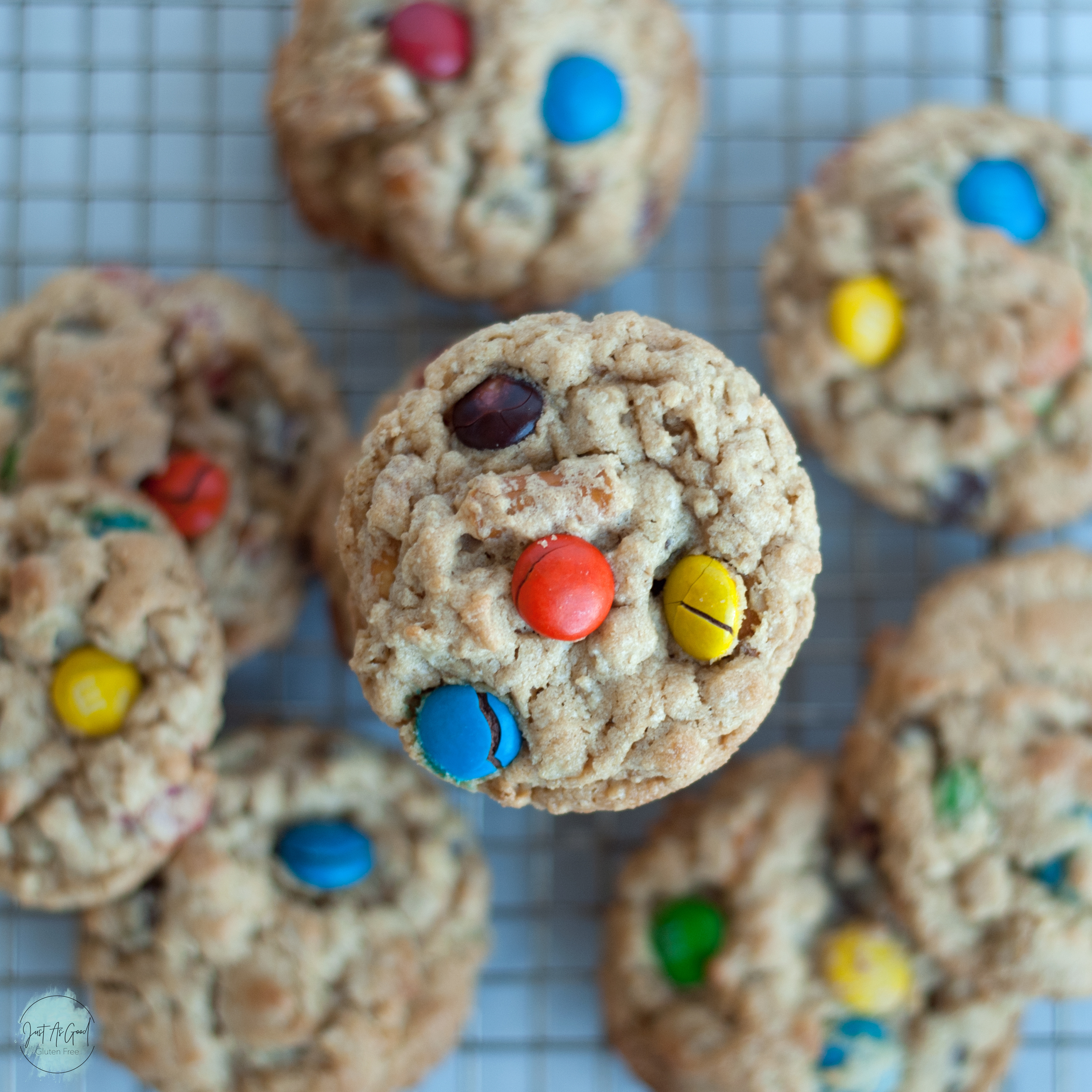 a top view of a stack of monster cookies with cookies blurred out beneath the stack