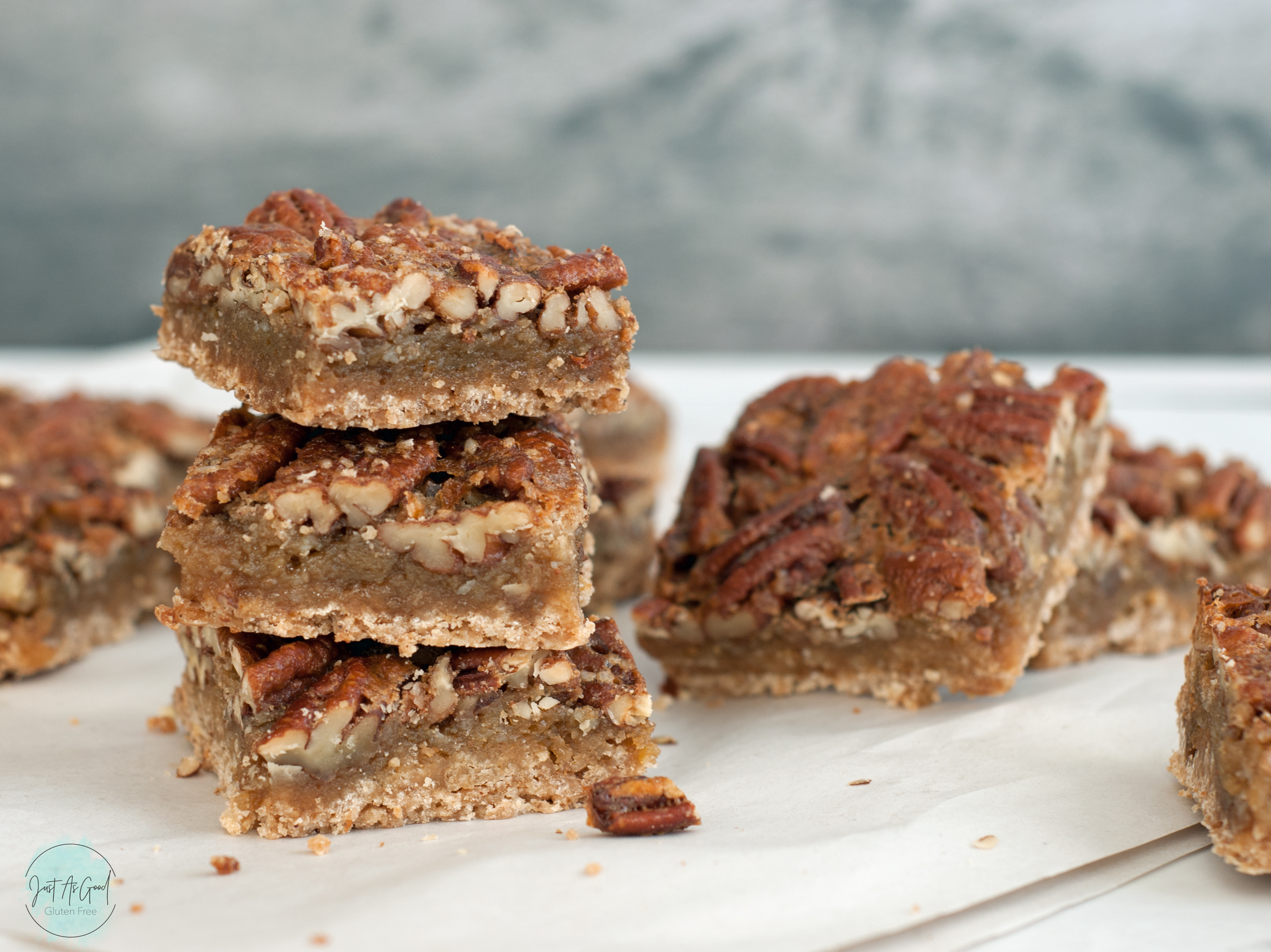 Side view of three stacked gluten free pecan pie bars