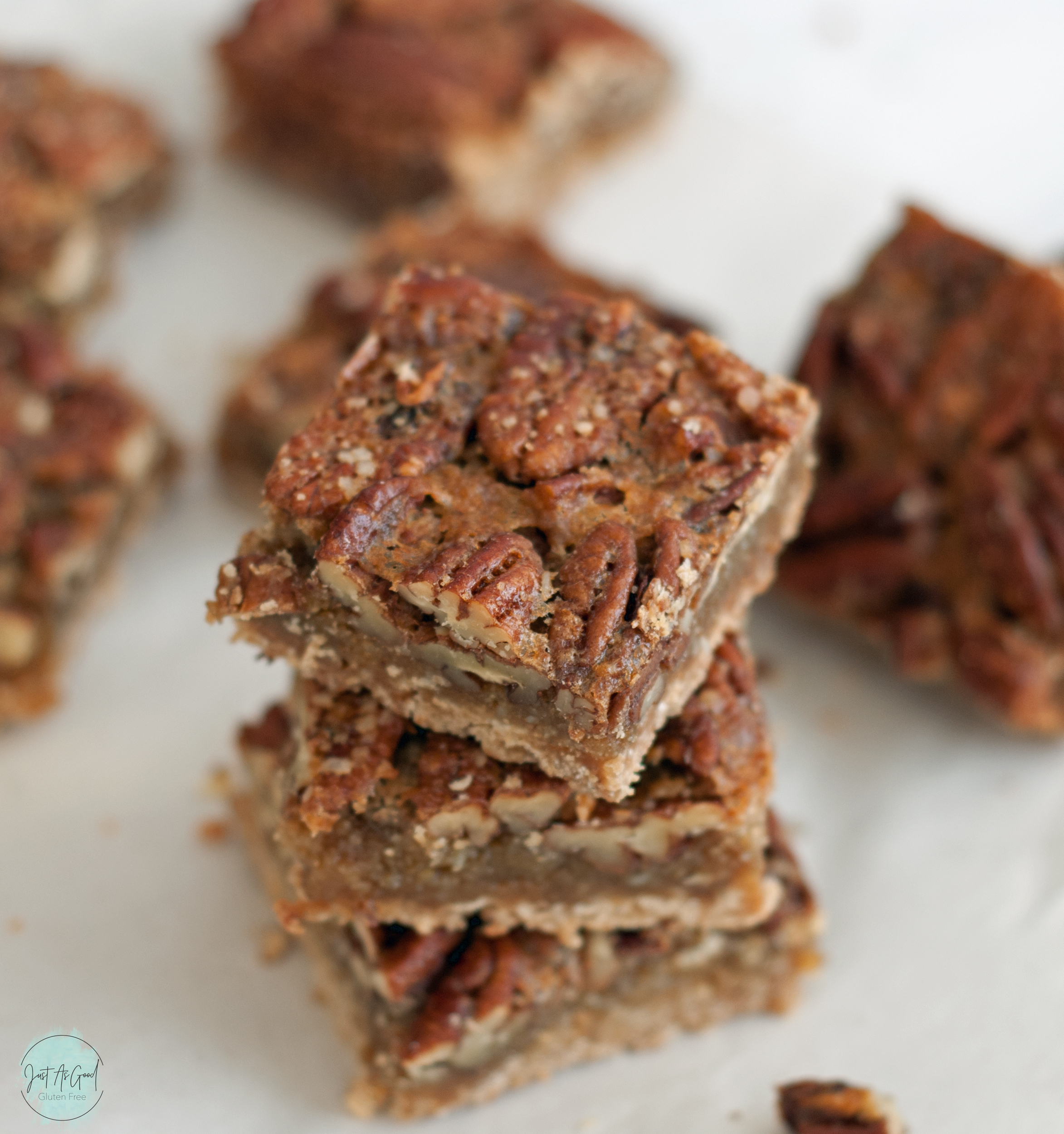 A stack of three gluten free pecan pie bars