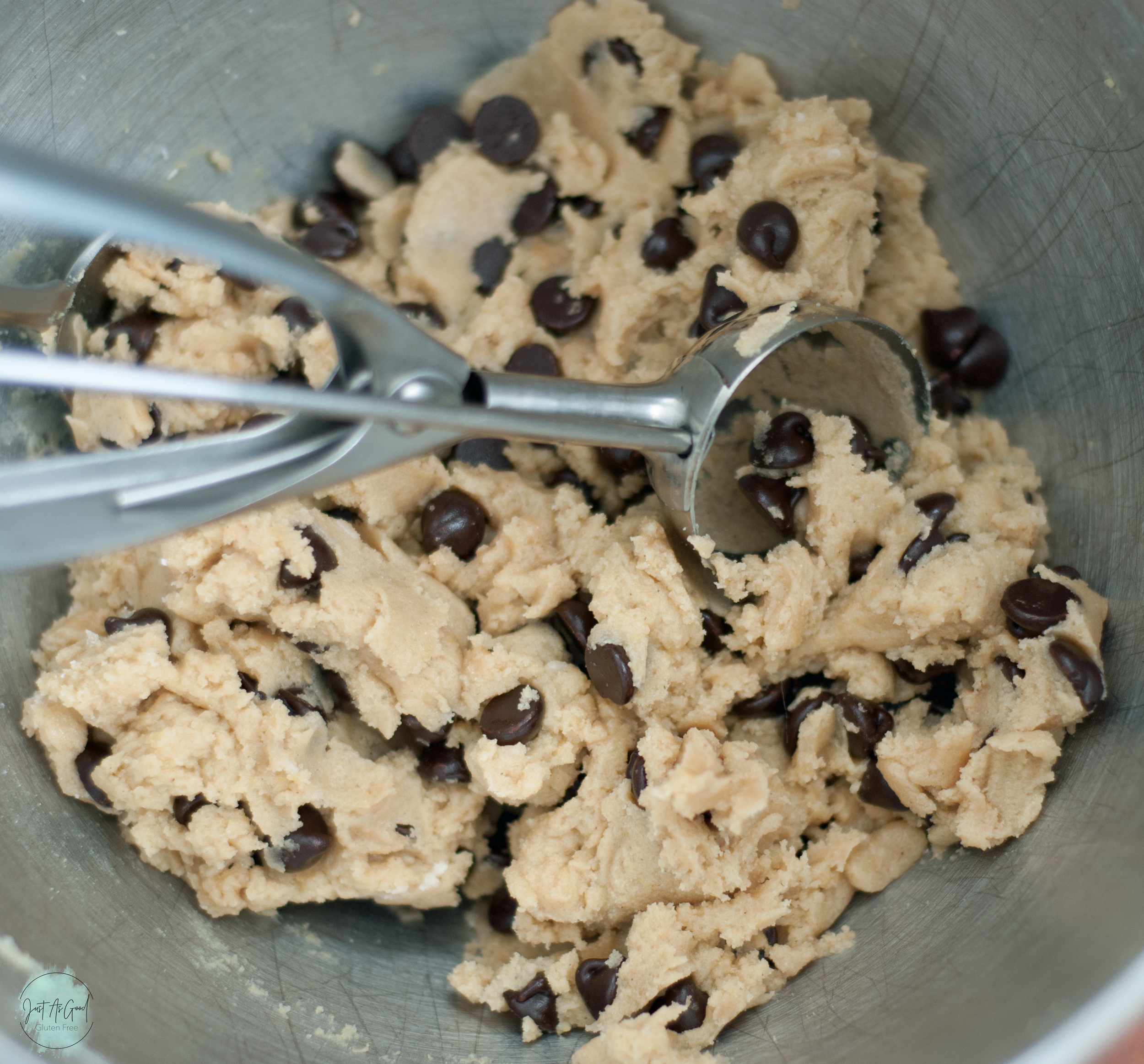 bowl of chocolate chip cookie dough with scoop