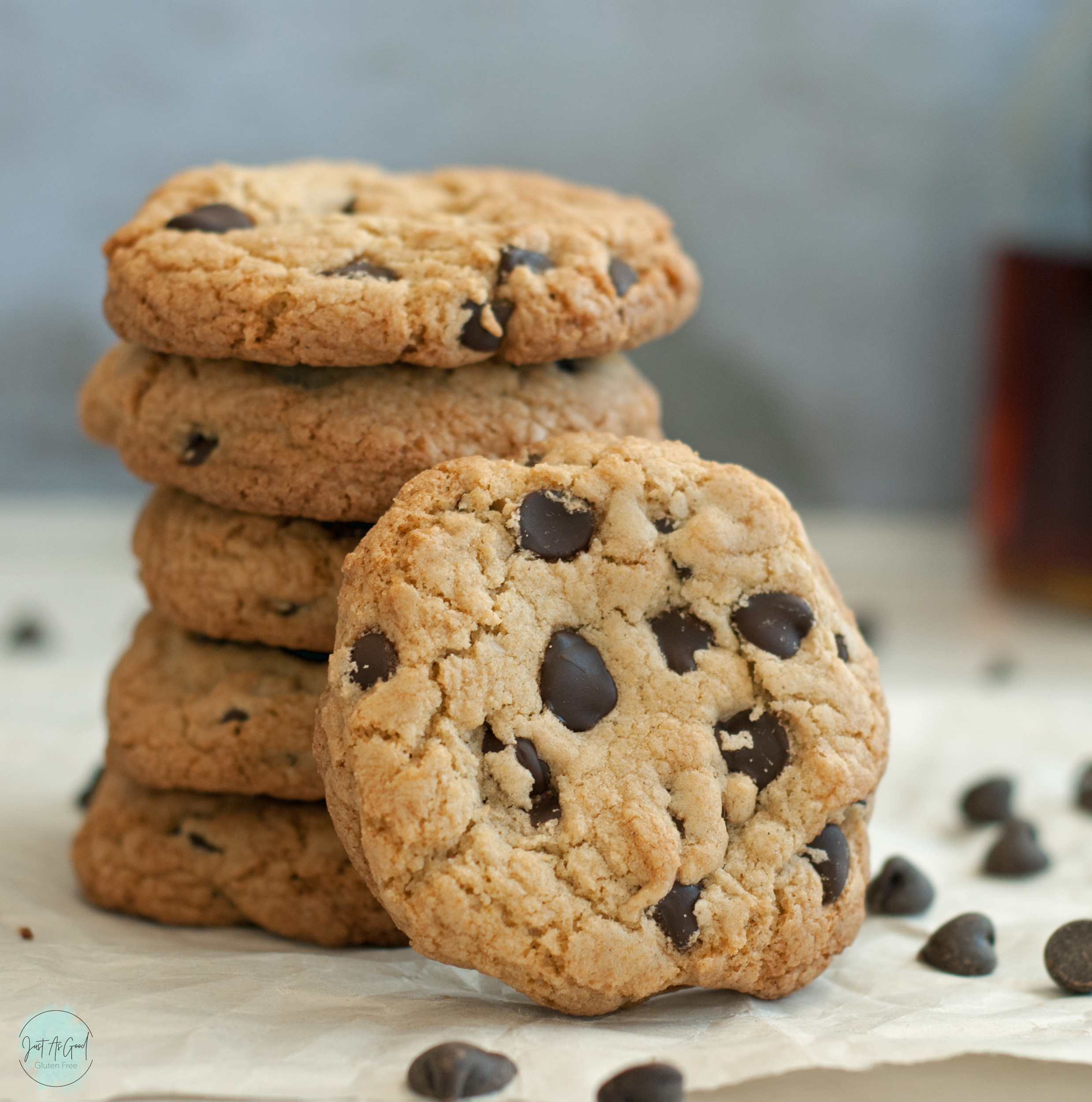 stack of five chocolate chip cookies with one tilted in front