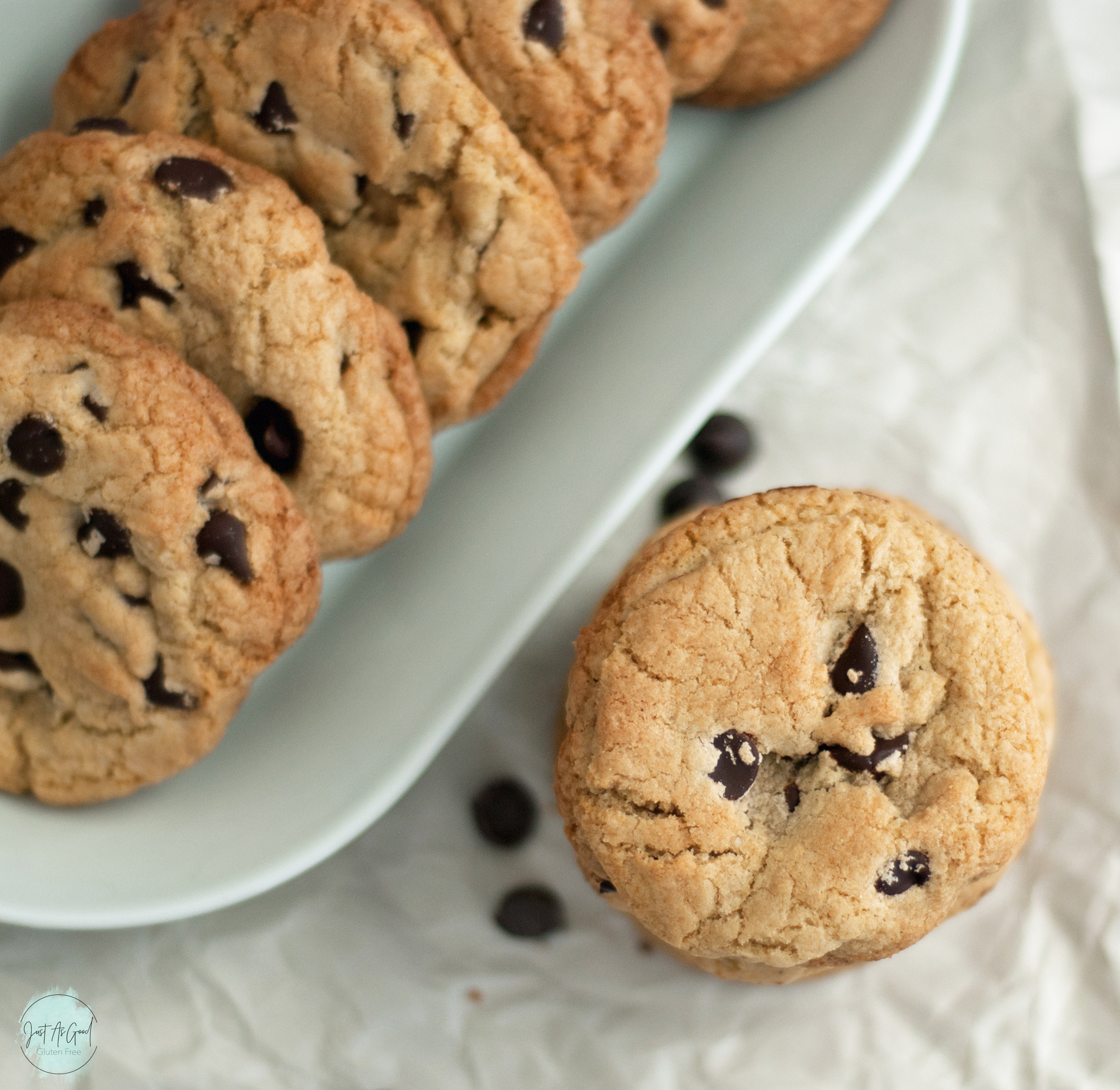 birds eye view of stacked chocolate chip cookies next to plate of cookies